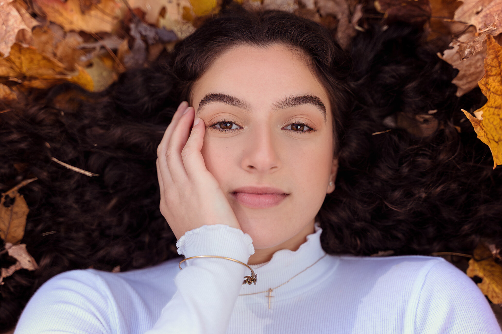 Close up Senior Portrait in the Fall leaves