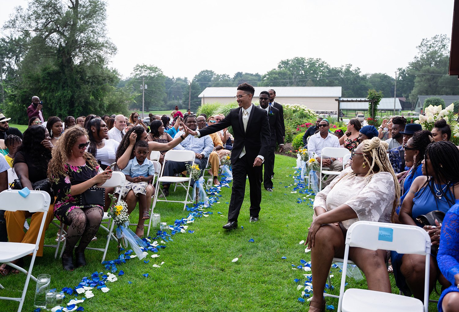 African American groom walking down  the aisle  