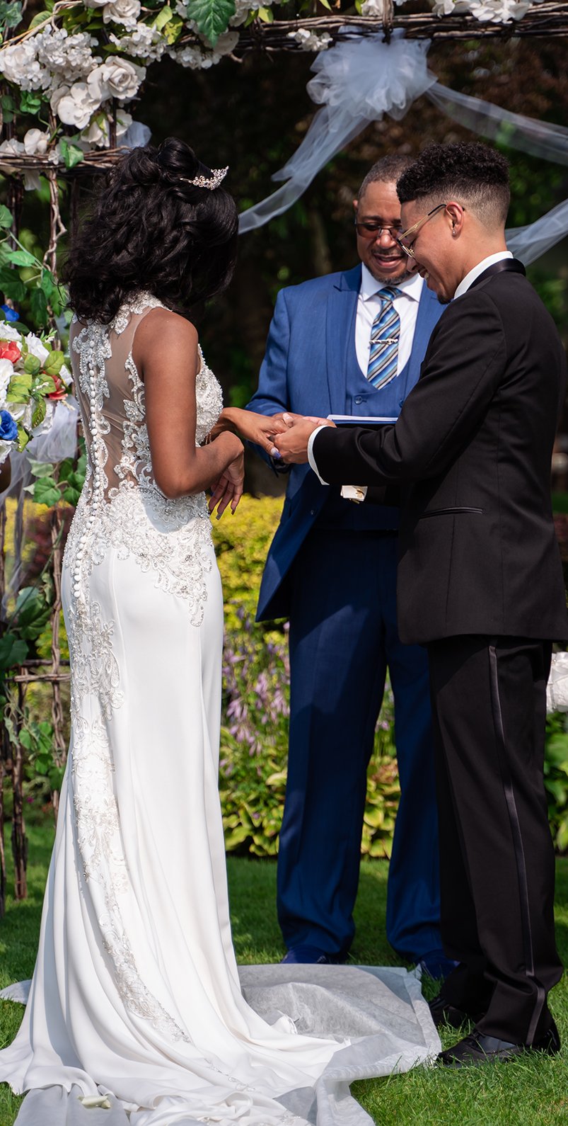 bride and groom exchanging wedding rings 