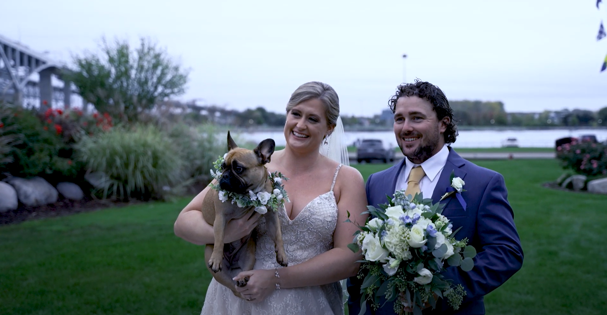 Newlywed bride and groom and their small dog