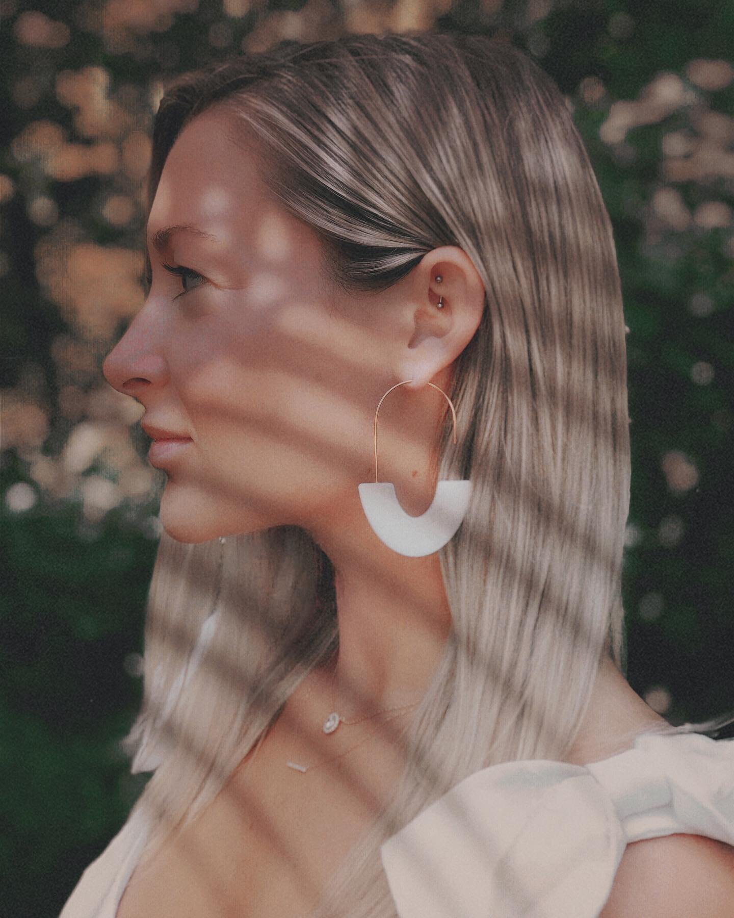 my beautiful friend, Lauren, modeling her pair of our modern resin pull through earrings!!🙌🏻 *available in the shop in black and white&mdash; made to order!* xo.M // #amourandink #amourandinkpaperco #resinart #resin #resinjewelry #resinartwork  #we