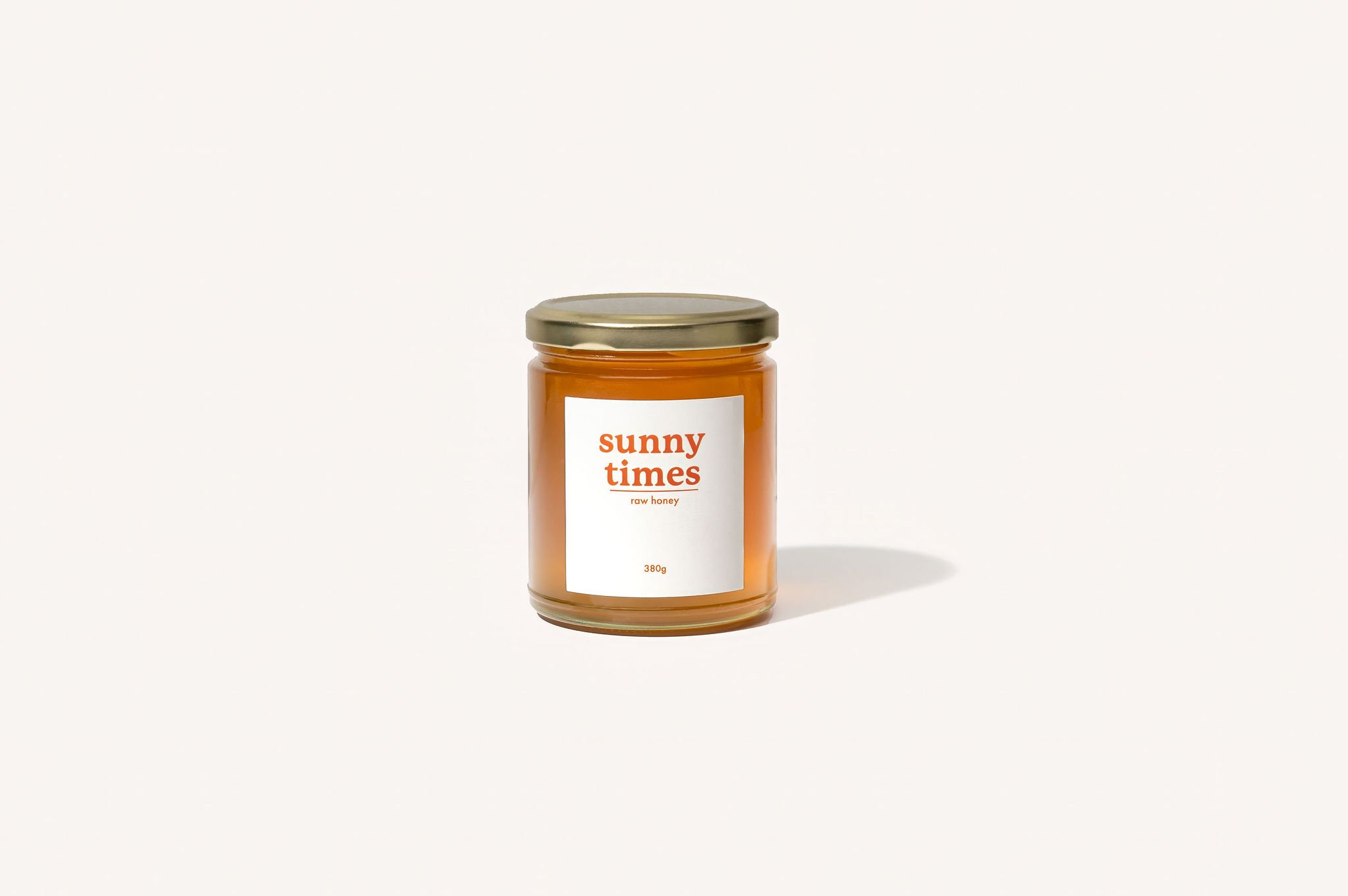Jar of Sunny Times raw unprocessed certified organic honey from our minimal intervention beekeeping farm in Tweed Valley NSW