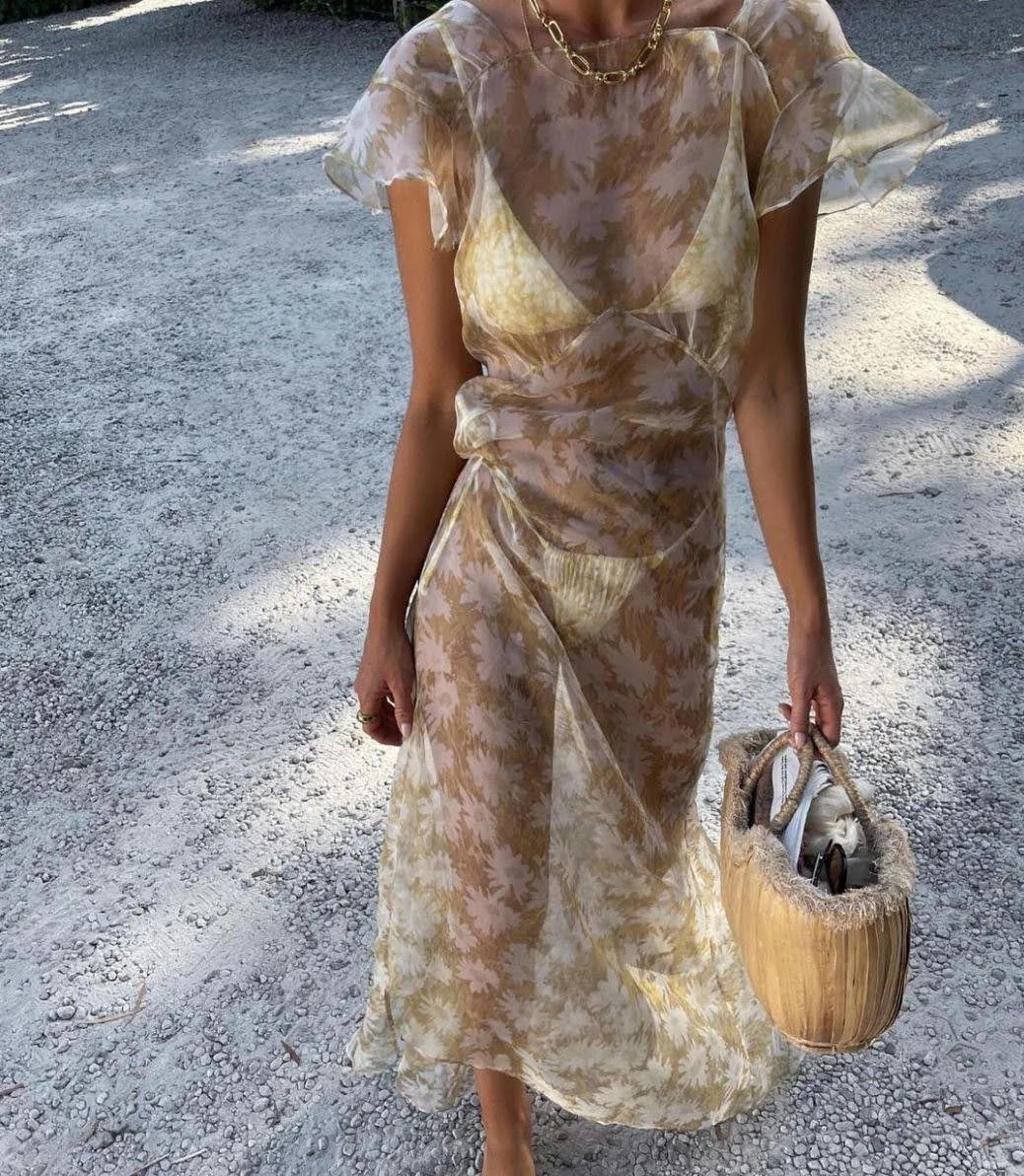 outfit photo showing woman wearing floral sheer skirt and matching top