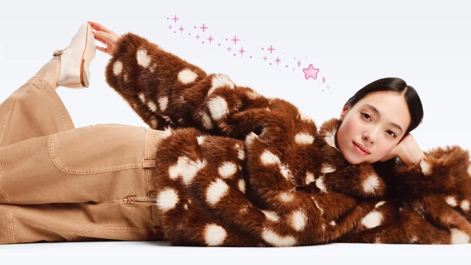 deer fawn patterned fur coat displayed on model