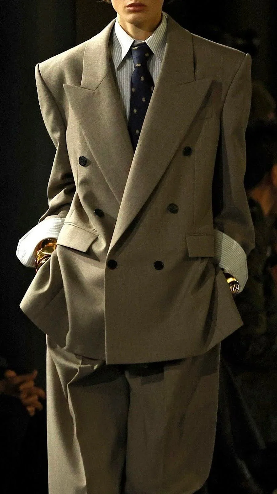 model close up wearing an 80s inspired business suit fashion