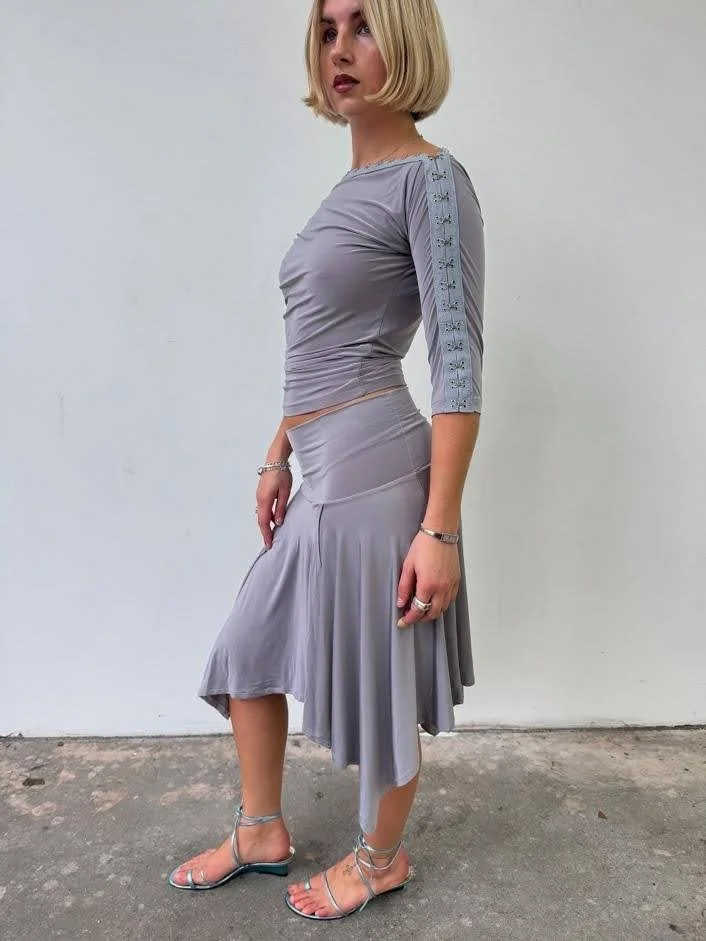 girl wearing matching skirt set grey flowy