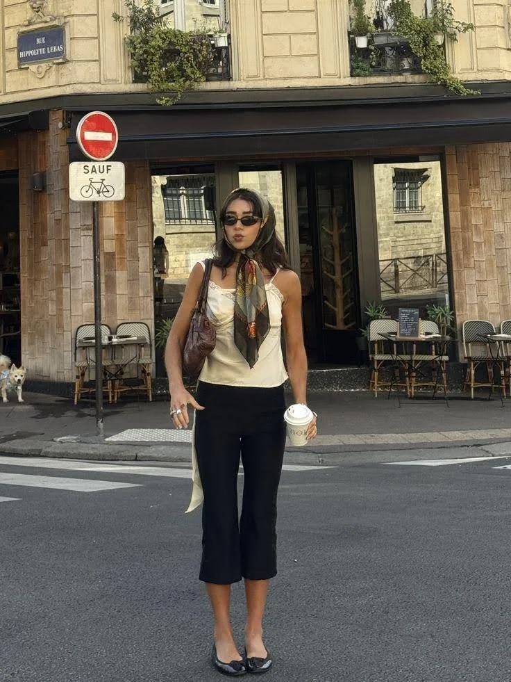 girl wearing black capris sunglasses and scarf