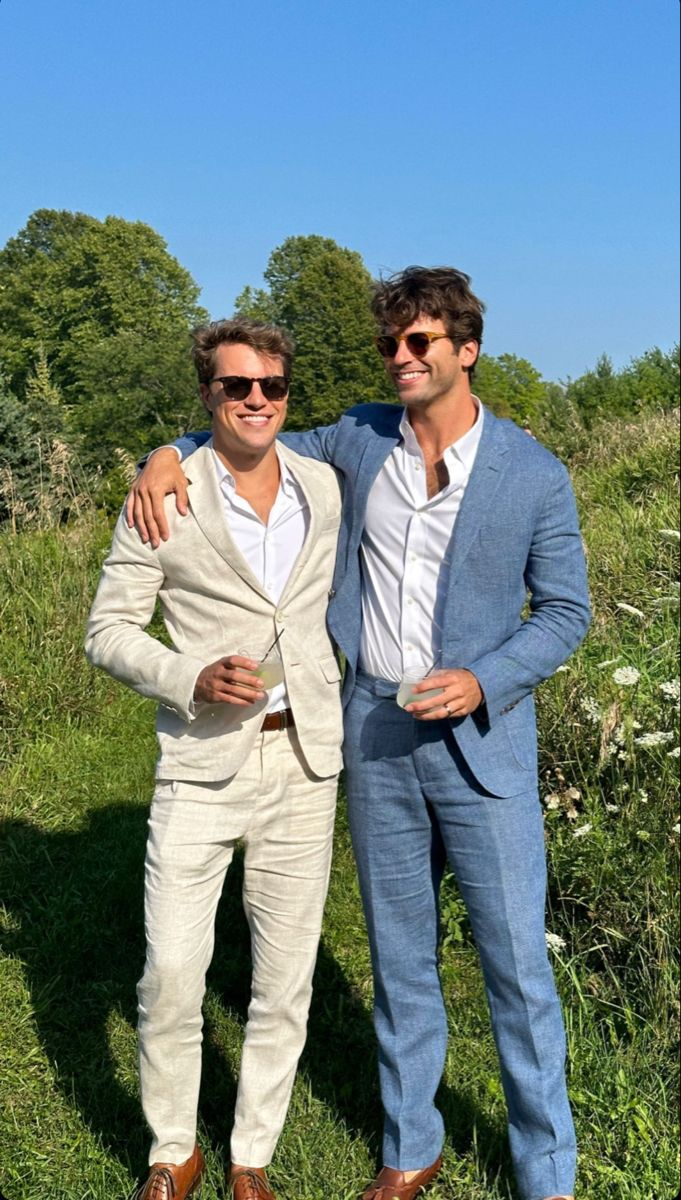 two men at a wedding wearing linen suits