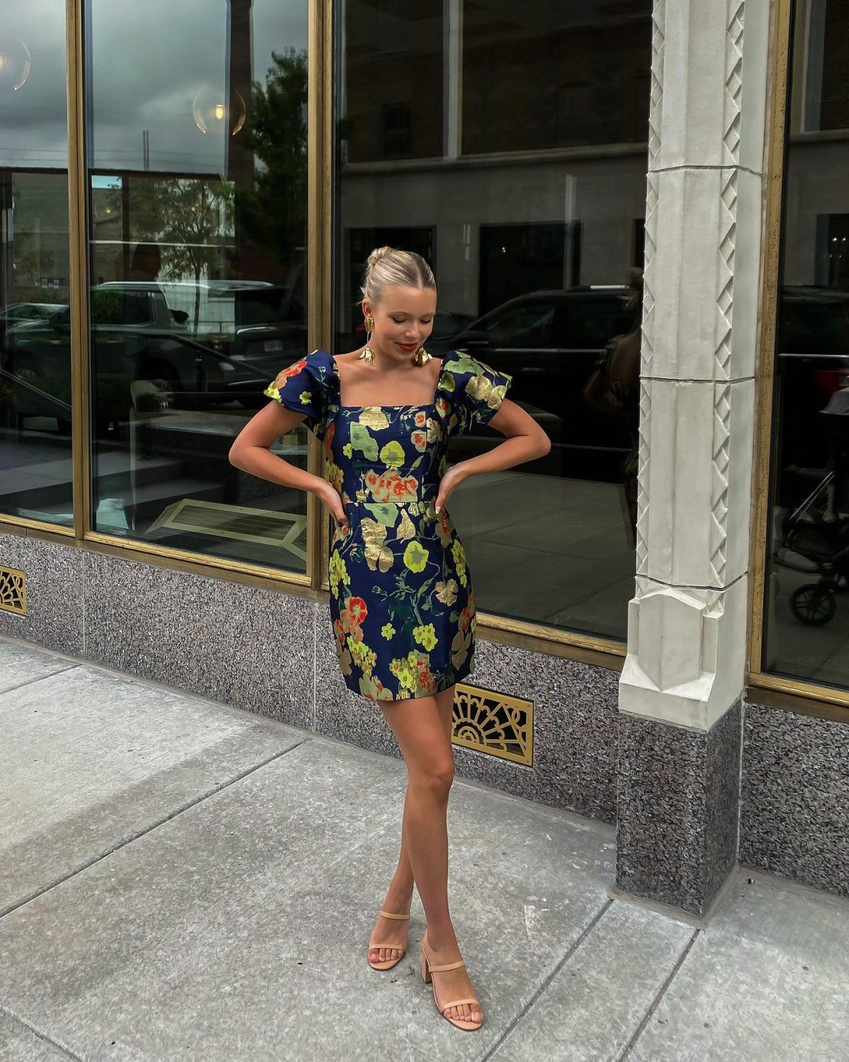 woman wearing blue mini floral dress