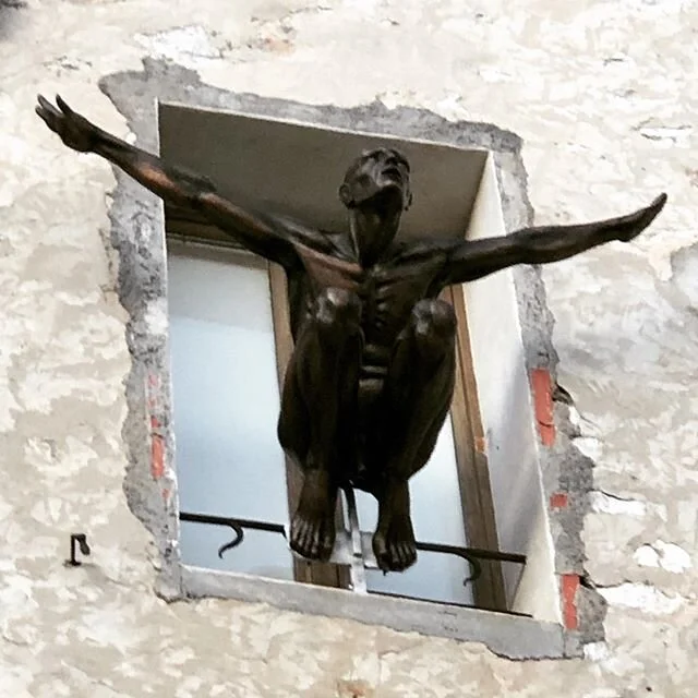 Sculpture poised high up on a window ledge over looking the valley below in St Paul de Vence. #sculpture #stpauldevence #nice #france #iloveart #ilovesculpture #colombd&rsquo;or