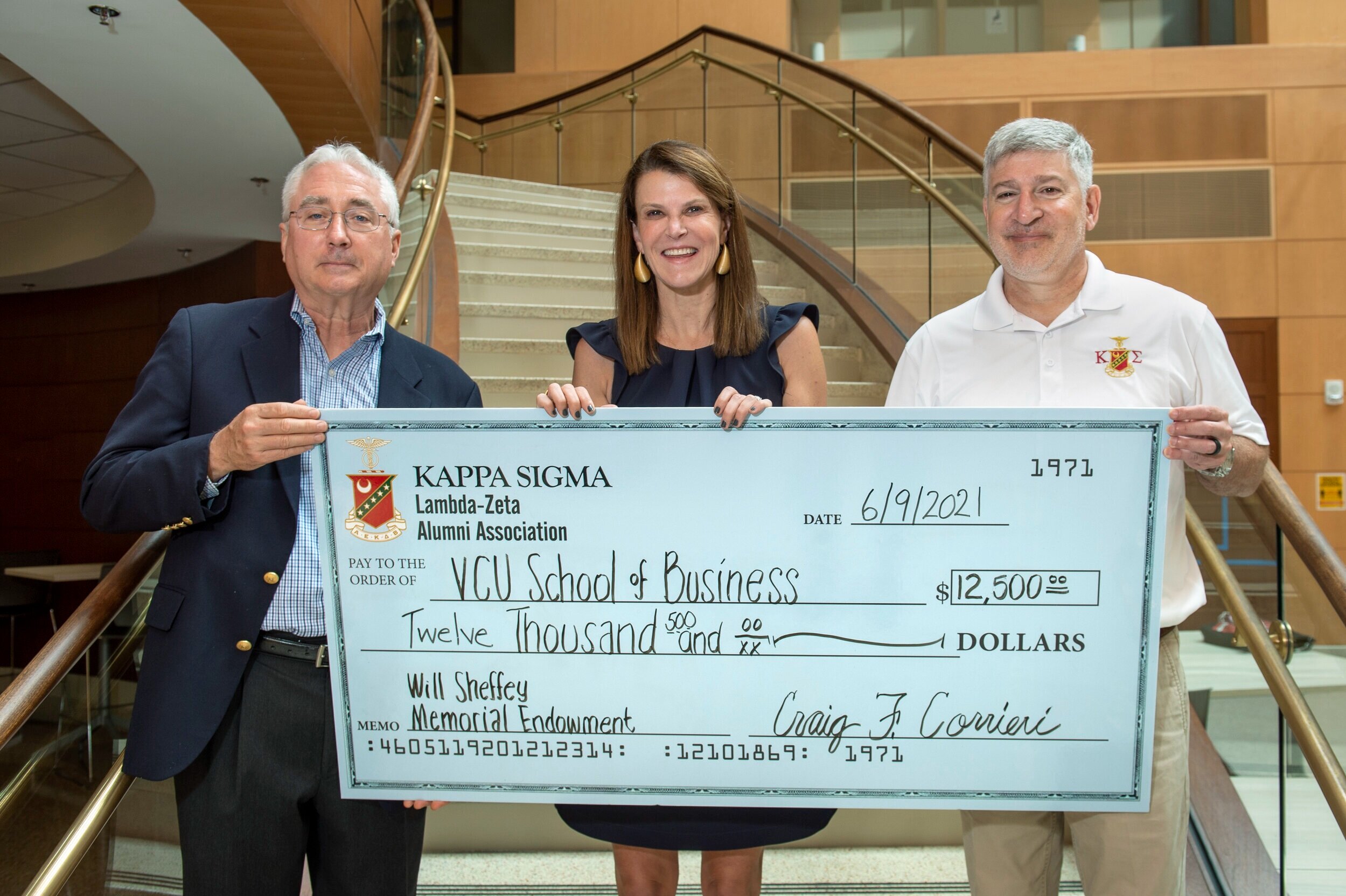   VCU’s Cheryl Slokker, Communications Director, and Katy Beisheim, Associate Director of Development (in glasses picture #2) accept a check to the Endowment on behalf of the VCU School of Business. Brad Welles and Craig Corrieri representing the End