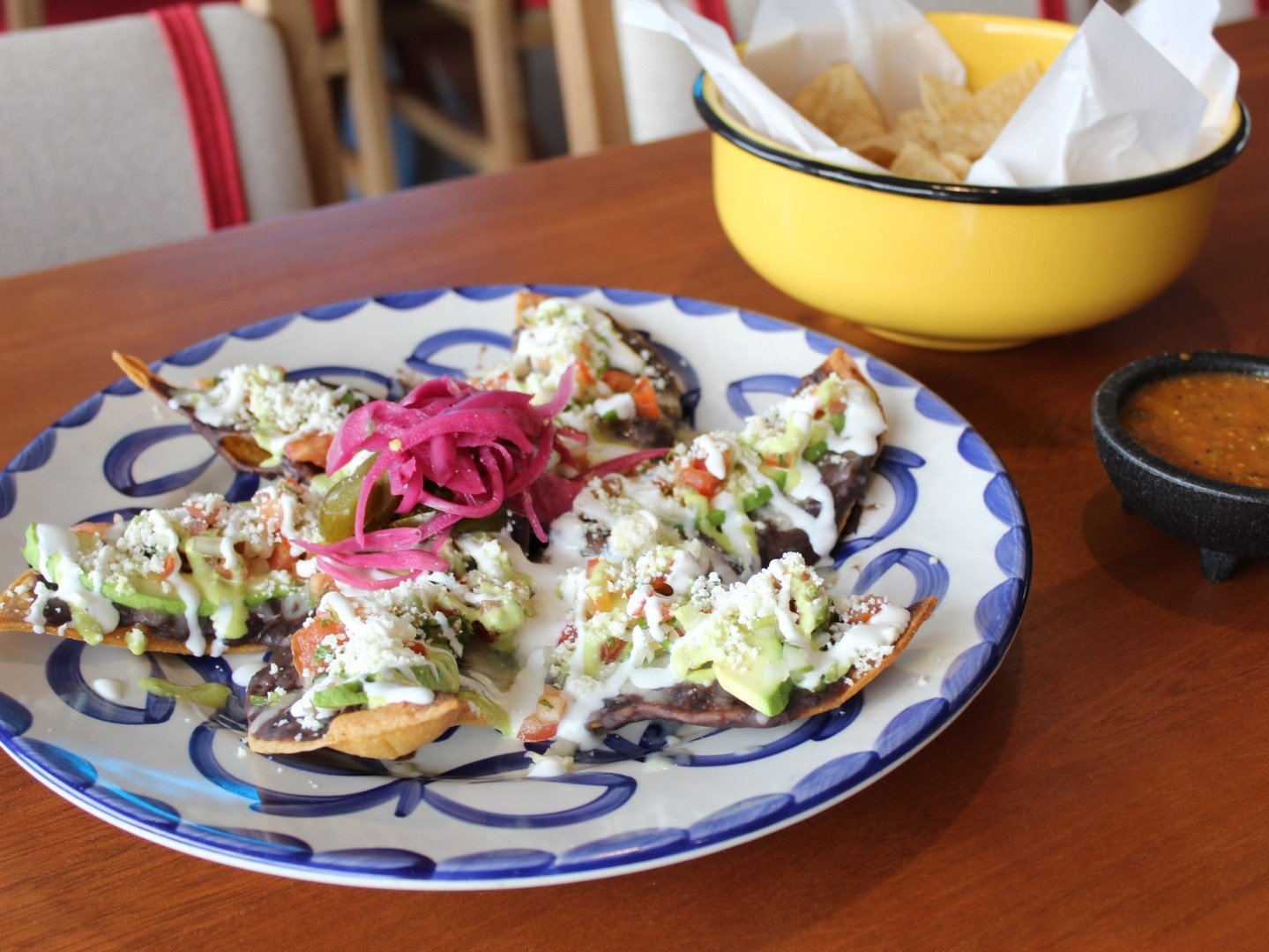 $8 for Mexico City-Style Nachos? 🤯

If we told you that our signature Totopas Catarina, covered with refried black beans, Monterrey jack cheese, pico de gallo, avocado, Mexican sour cream, queso fresco, and jalape&ntilde;o sauce, then garnished with