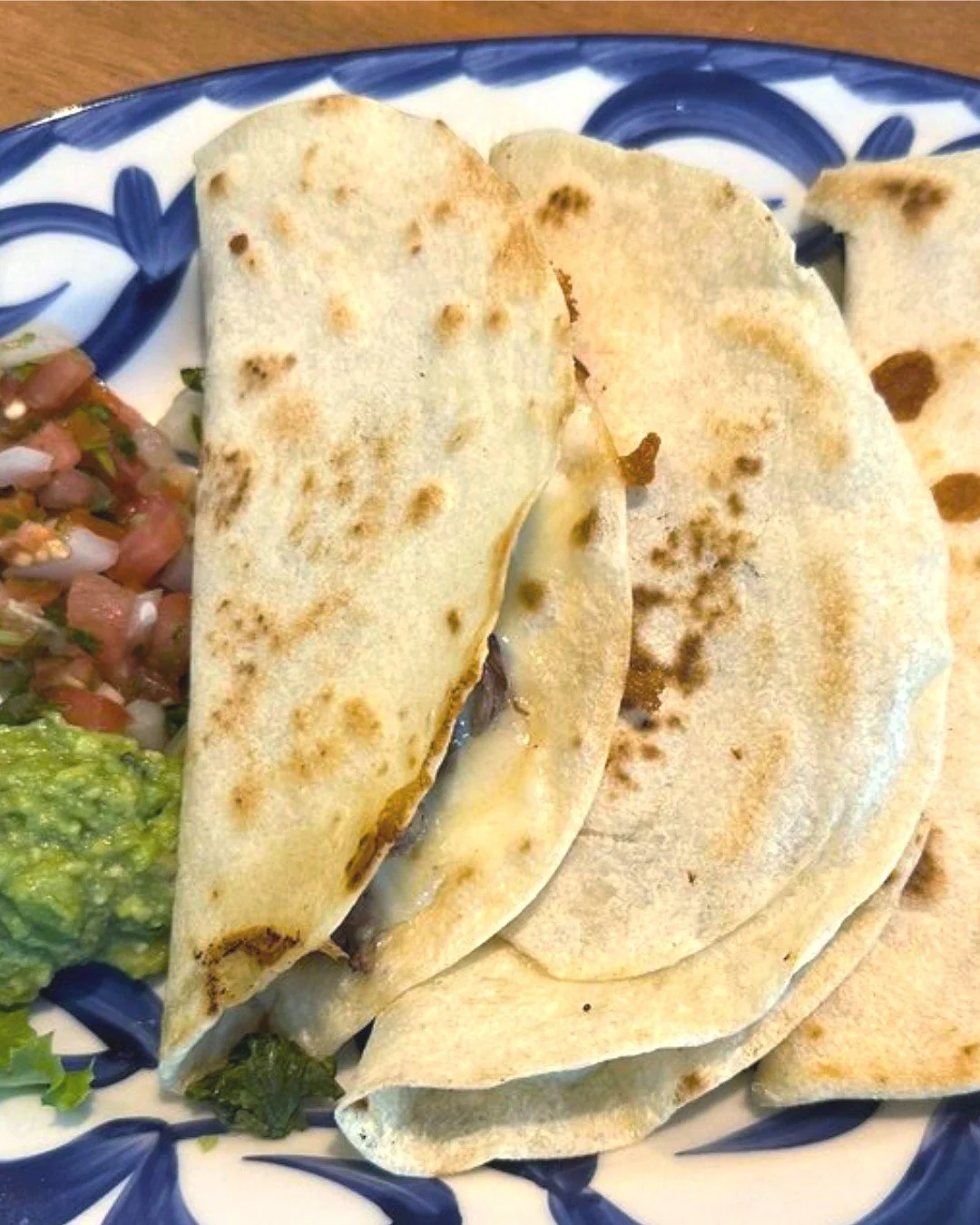 Fresh tortillas. Melted cheese. What more do you need? 😍 Come celebrate National Quesadilla Day with our homemade quesadillas, filled with roasted jalape&ntilde;os and onions + your choice of chicken, beef, shrimp, huitlacoche, or classic cheese. 

