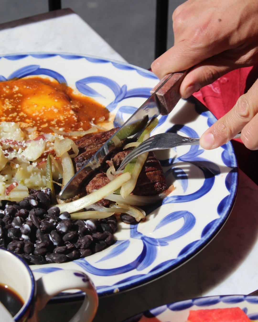 Brunch with a little spice. 🔥 Meet the Filete Ranchero &mdash; grilled Black Angus tenderloin topped with salsa ranchera and served with black beans, potatoes, and two over-easy eggs. Pair it with a mimosa or our homemade red sangria for the perfect