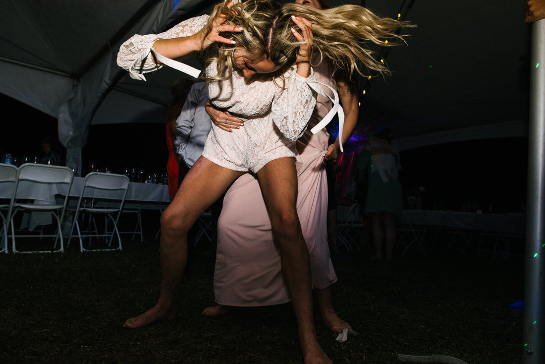 Girl dancing wild in the wedding party