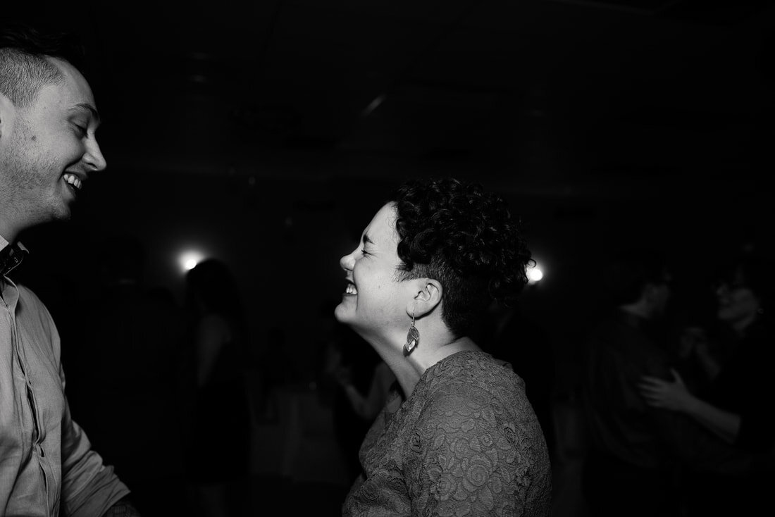 Black and white picture of guests dancing in the party