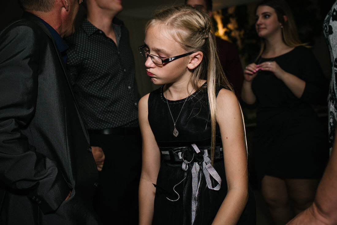 Girl wearing glasses dancing in the party