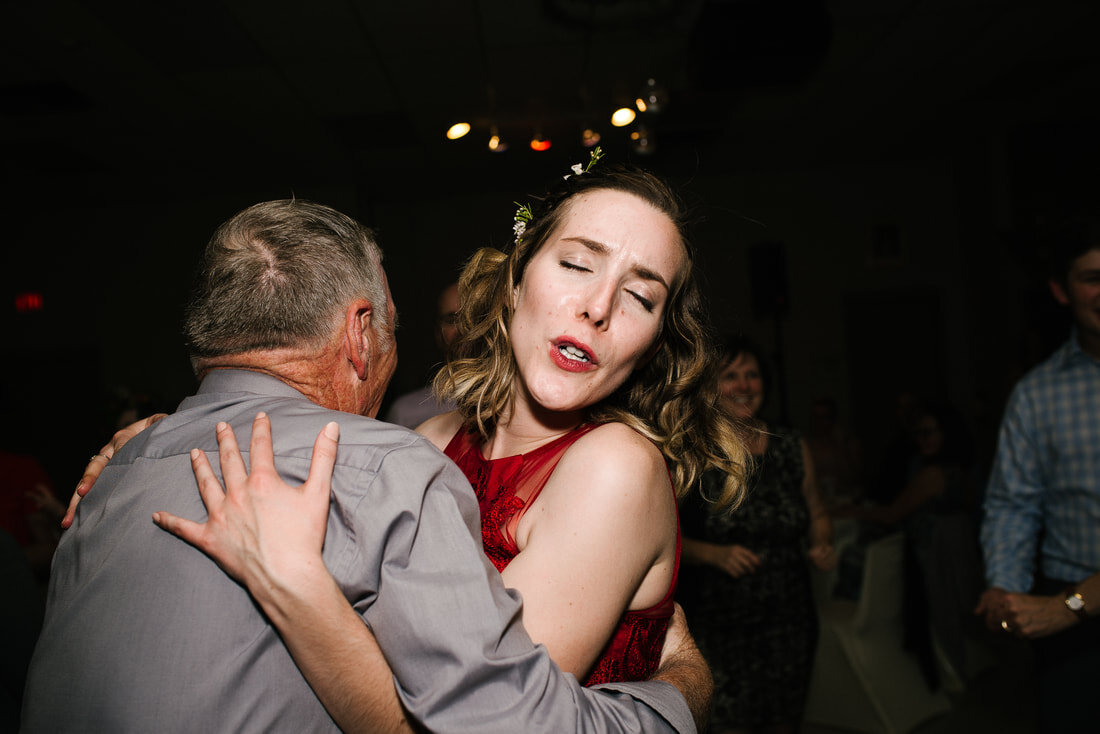 Man and woman hugging each other dancing in the party.