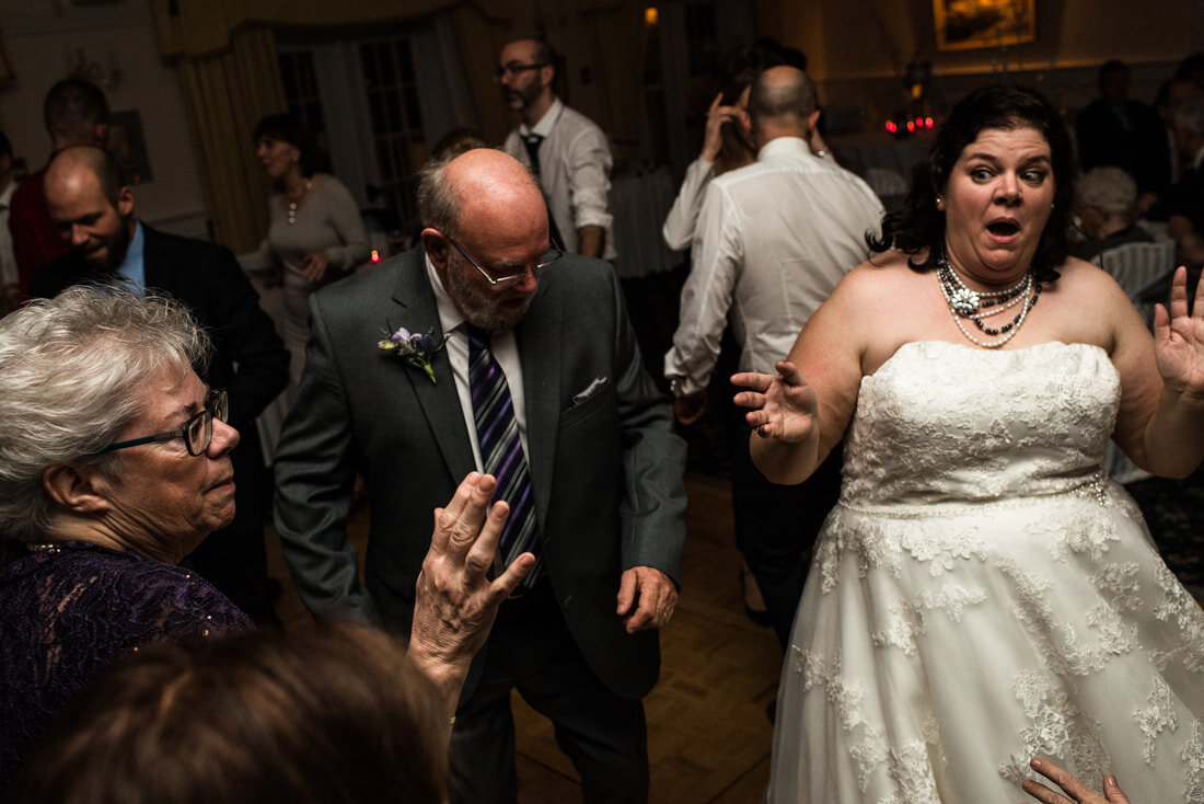 Bride dancing in the wedding party with another guests
