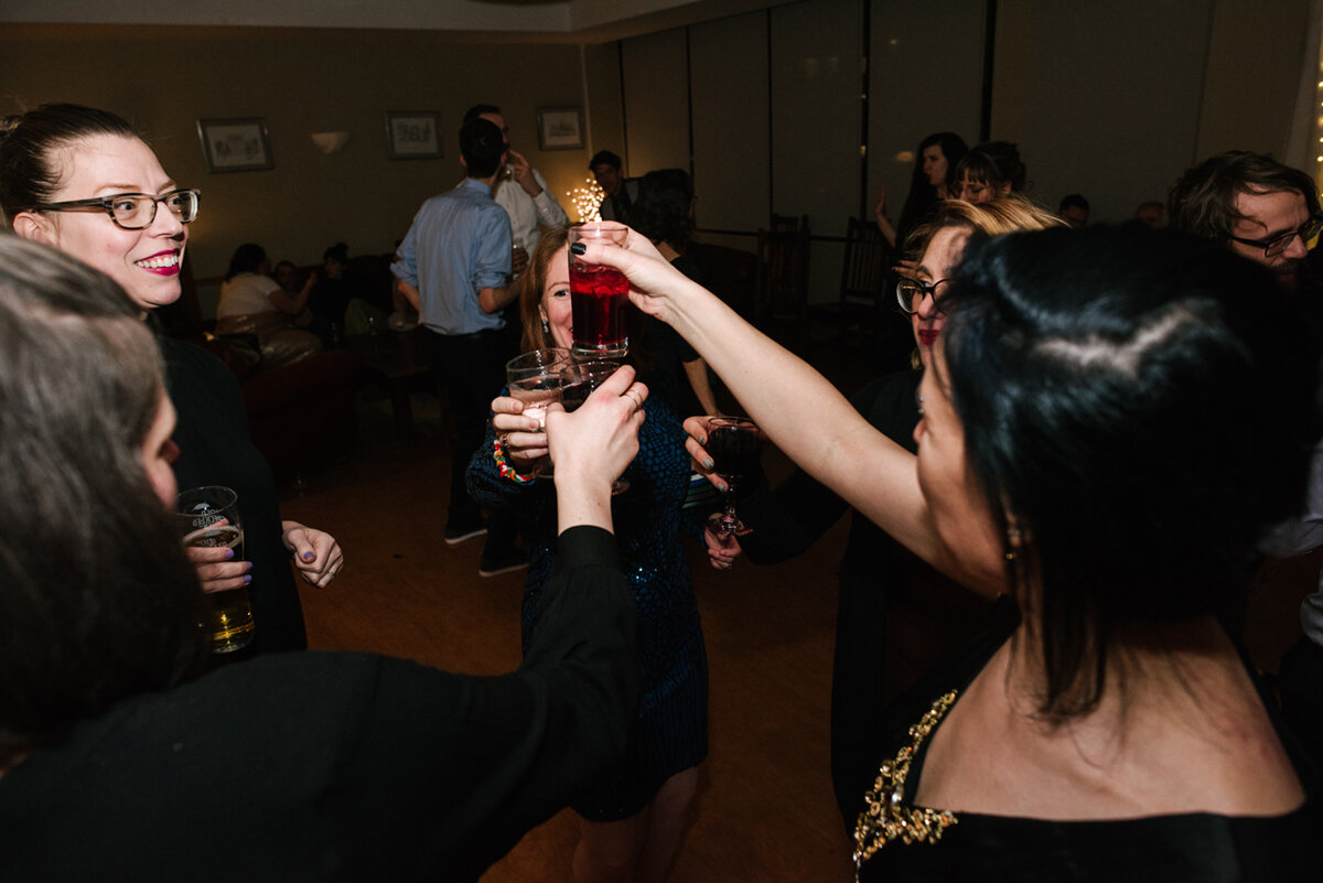 Guests toasting their drinks