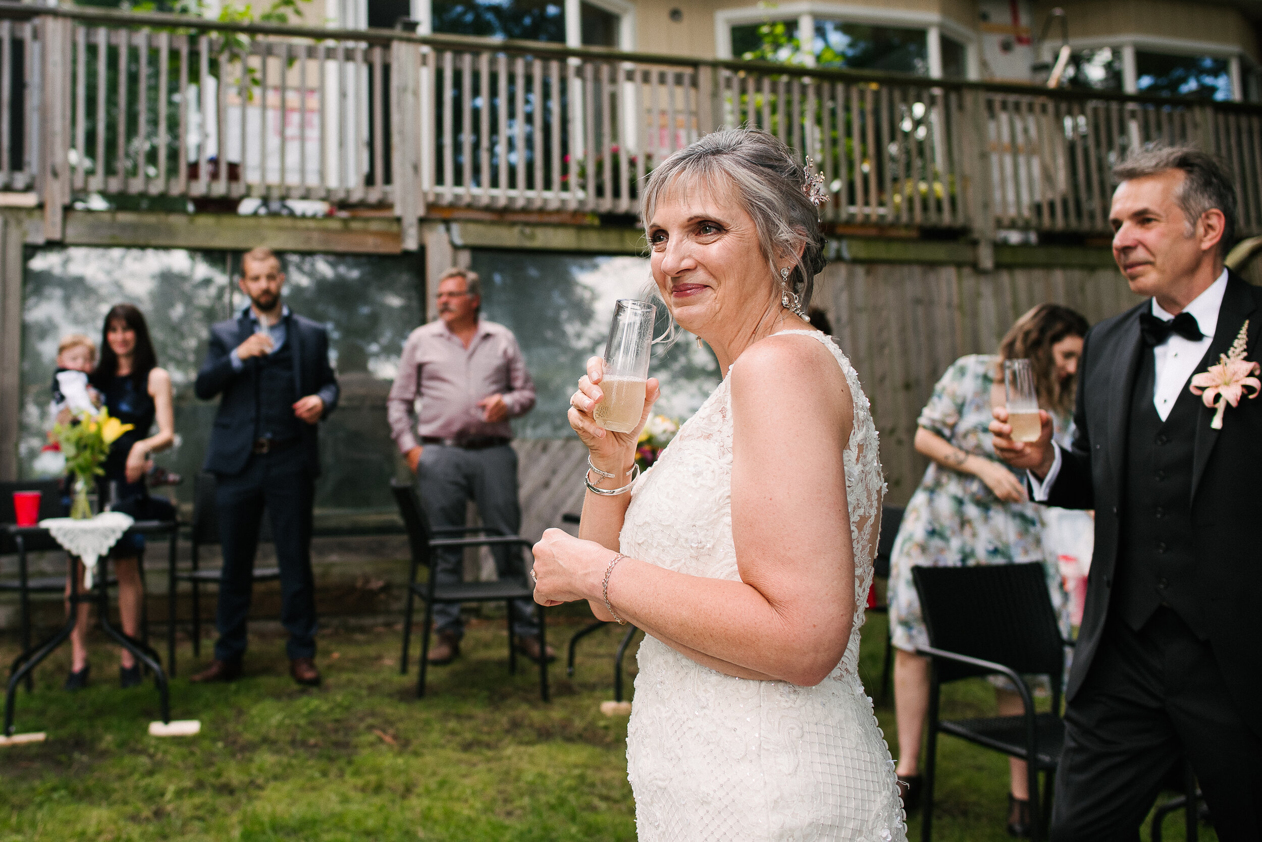 Bride sips champagne at her wedding in Verona, Ontario