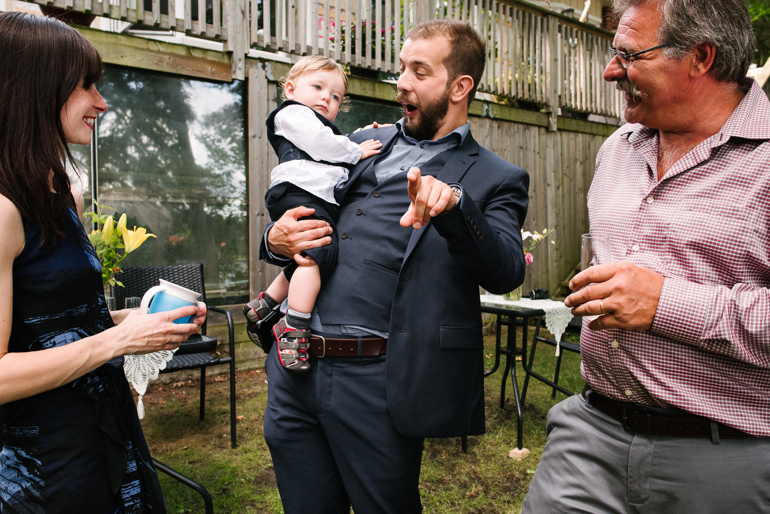 Groom's son and grandson celebrate at their father's wedding in Verona, Ontario