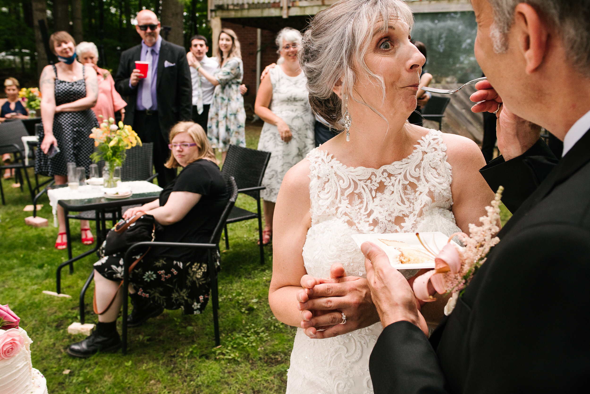 Groom feeding bride cake at Verona, Ontario wedding 