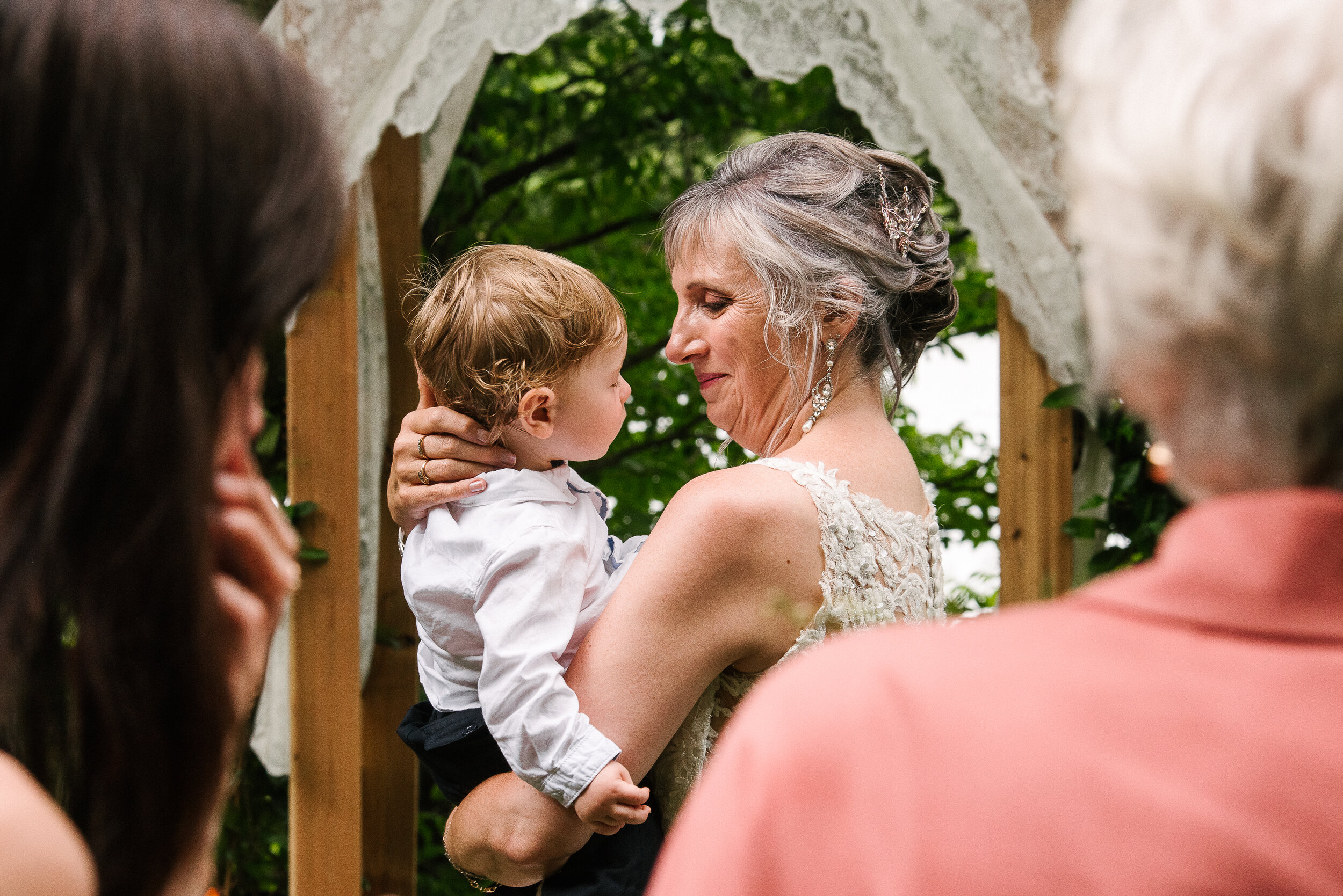 Bride holding her grandson at Verona, Ontario wedding 