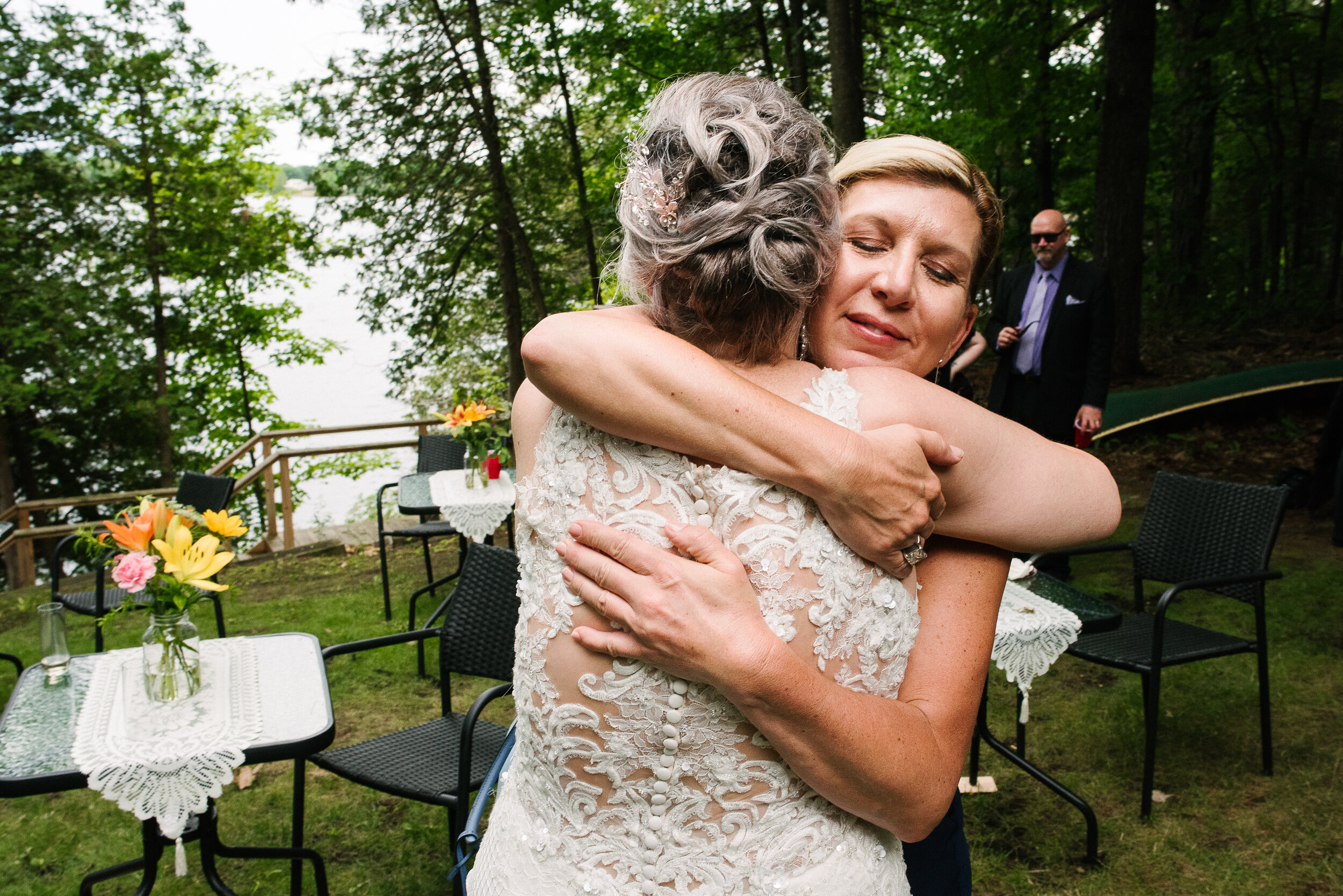 Bride hugging friend at Verona, Ontario wedding 