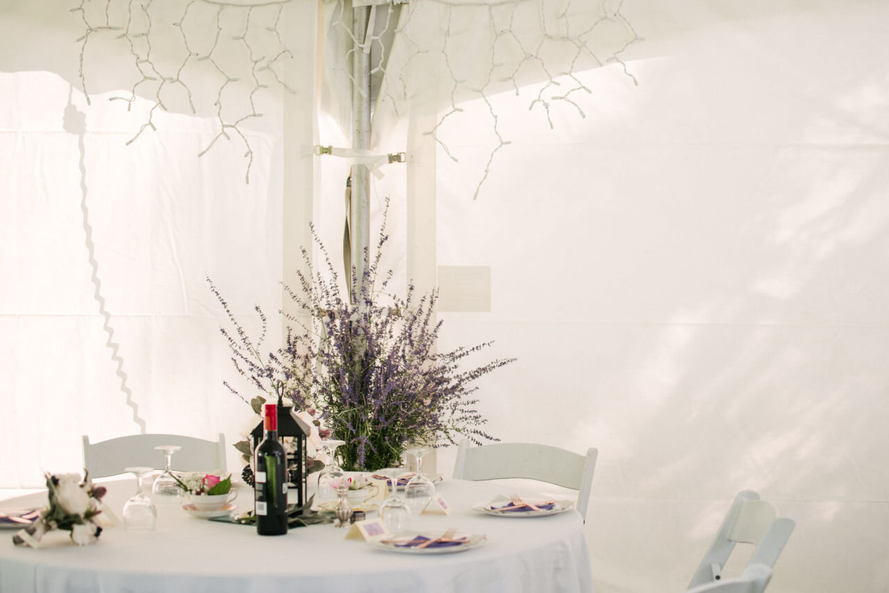Pure white table setting in a tent at Ottawa wedding 