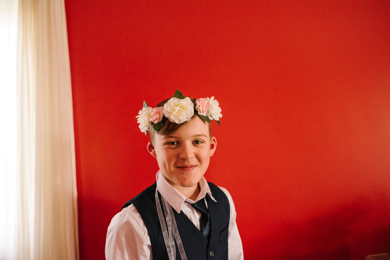 Son of bride wearing flower crown at Ontario elopement venue
