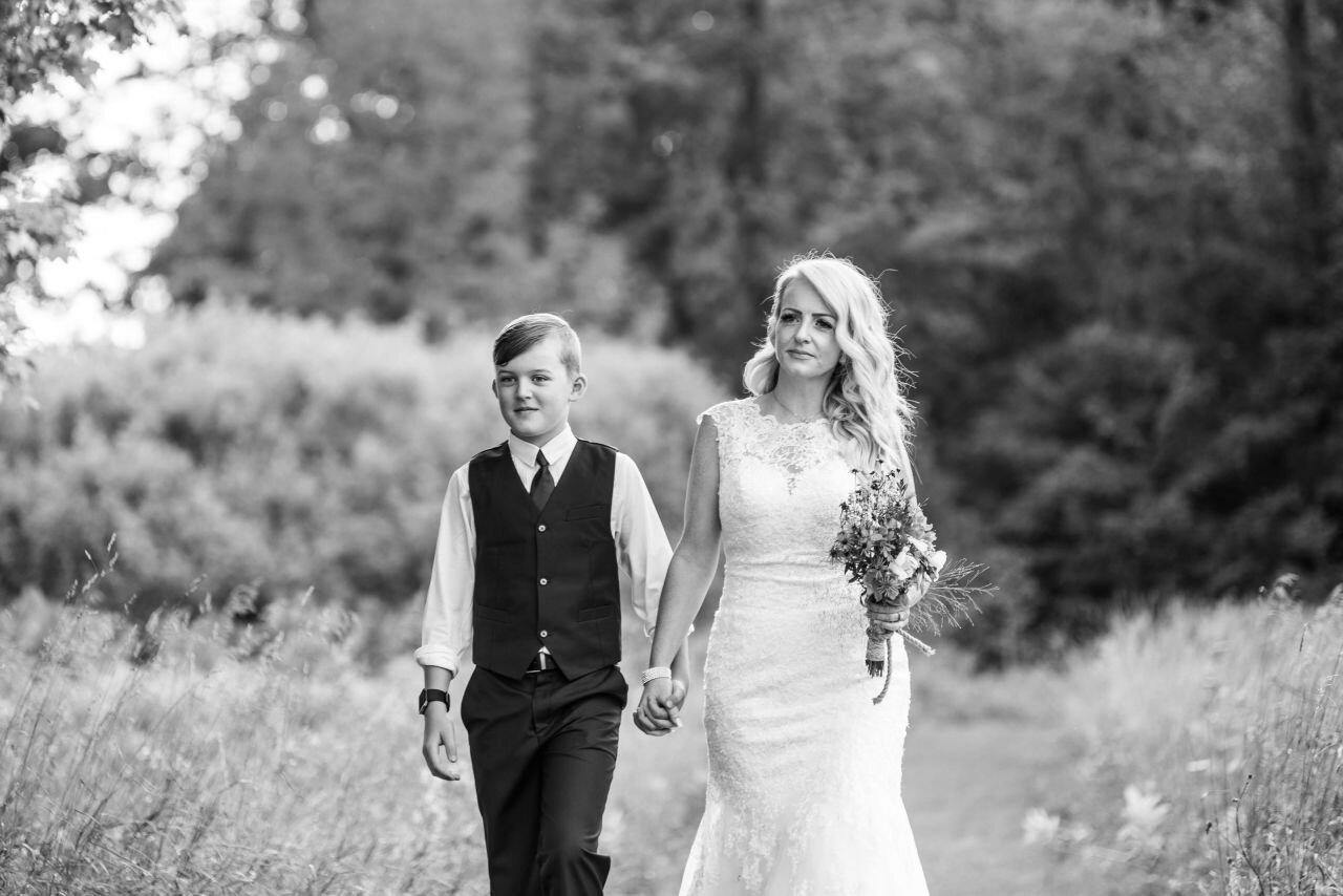 Bride being walked down aisle by her son at rural Ontario elopement 