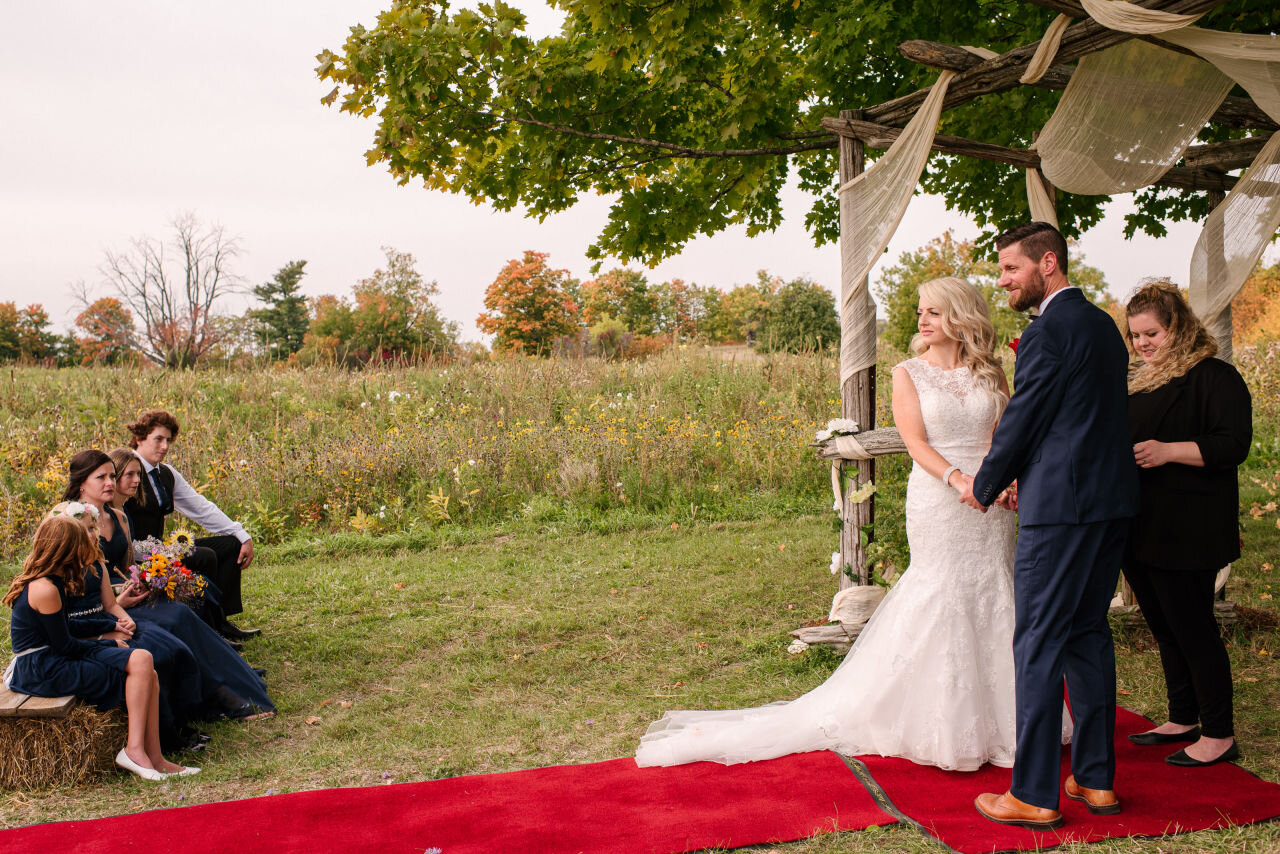 Bride and groom during ceremony at rural Ontario elopement 