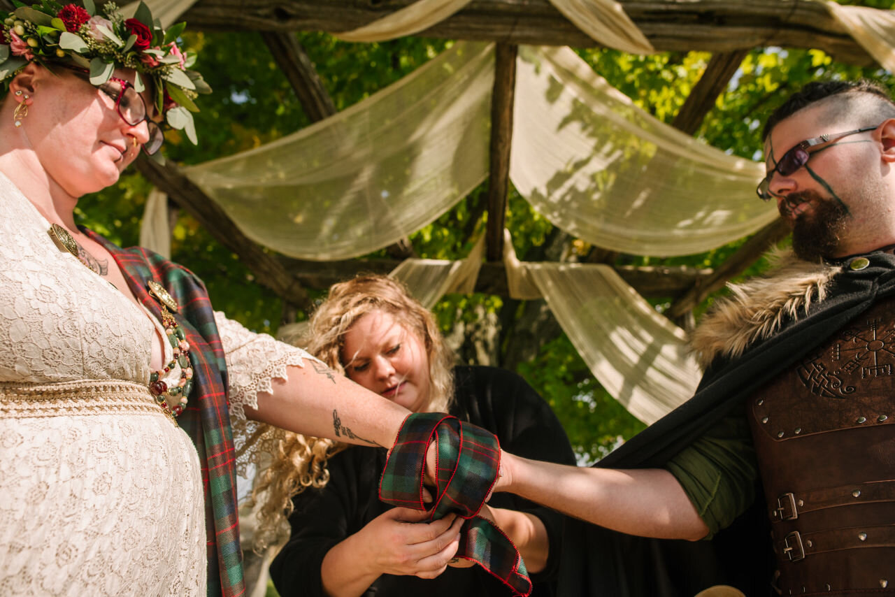 Bride and groom during traditional ceremony at rural elopement near Kingston, Ontario