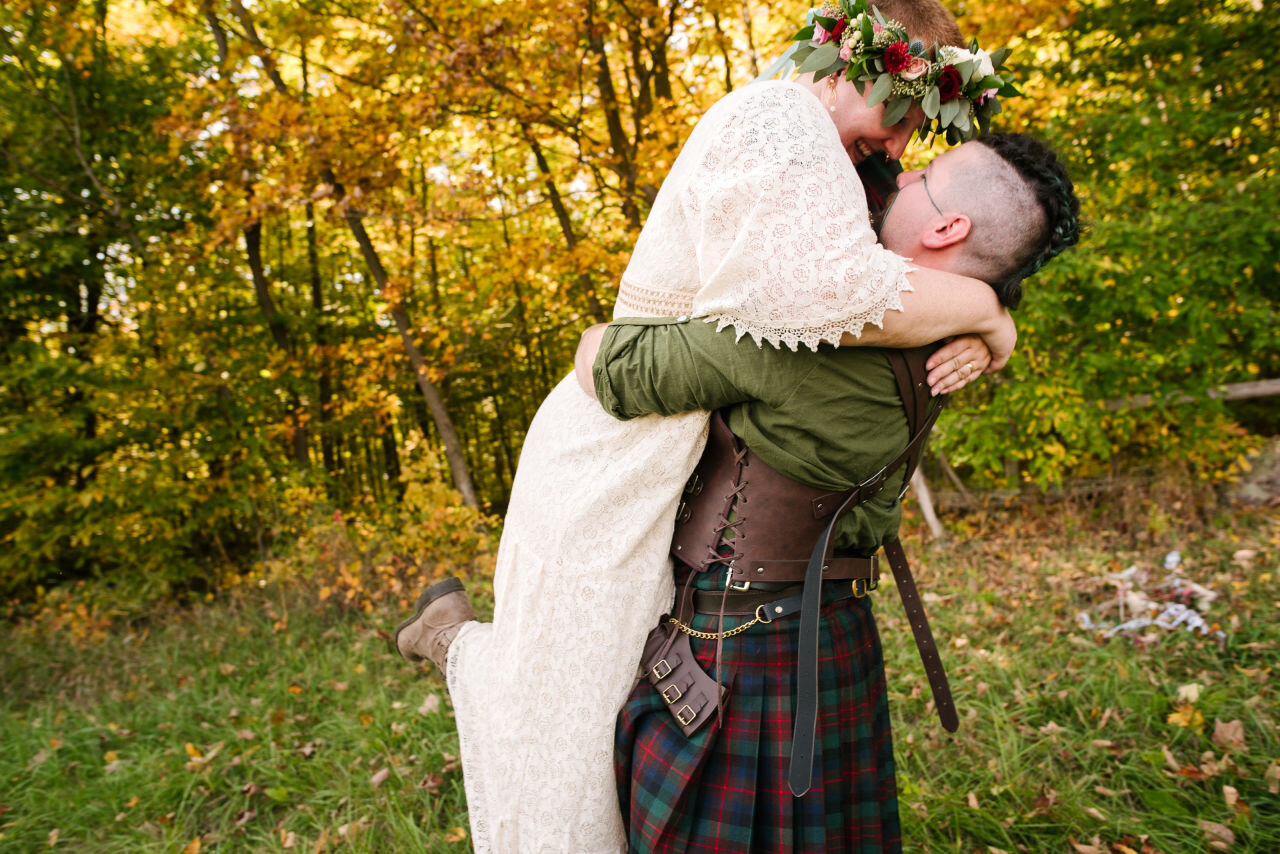 Bride and groom kissing at rural elopement near Kingston, Ontario