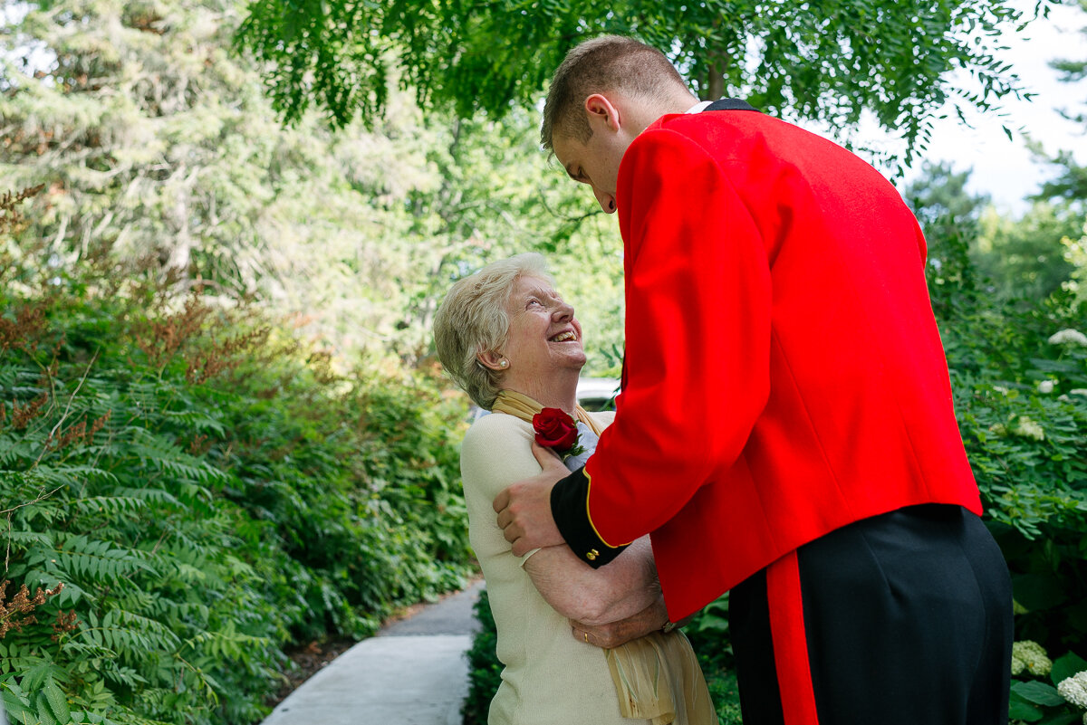 Groom and his mother laughing before the ceremony