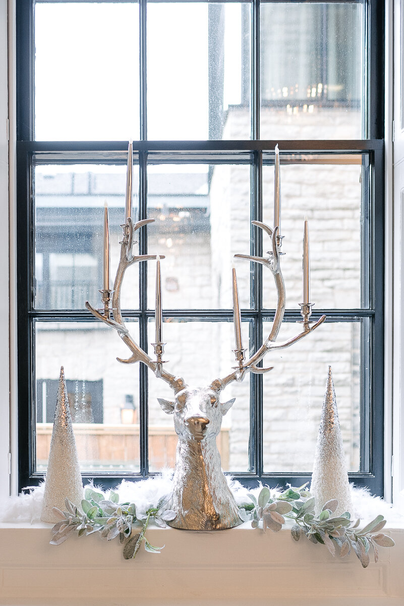 winter wedding decor of silver reindeer and trees 
