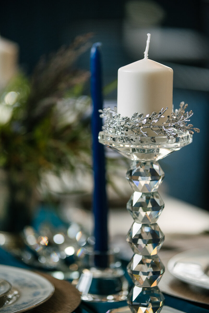 Winter wedding styled dinner table, tall candle pillar 