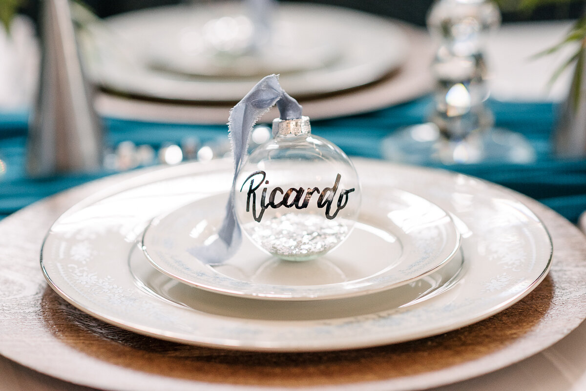 Winter wedding styled dinner table, name on glass ornament 