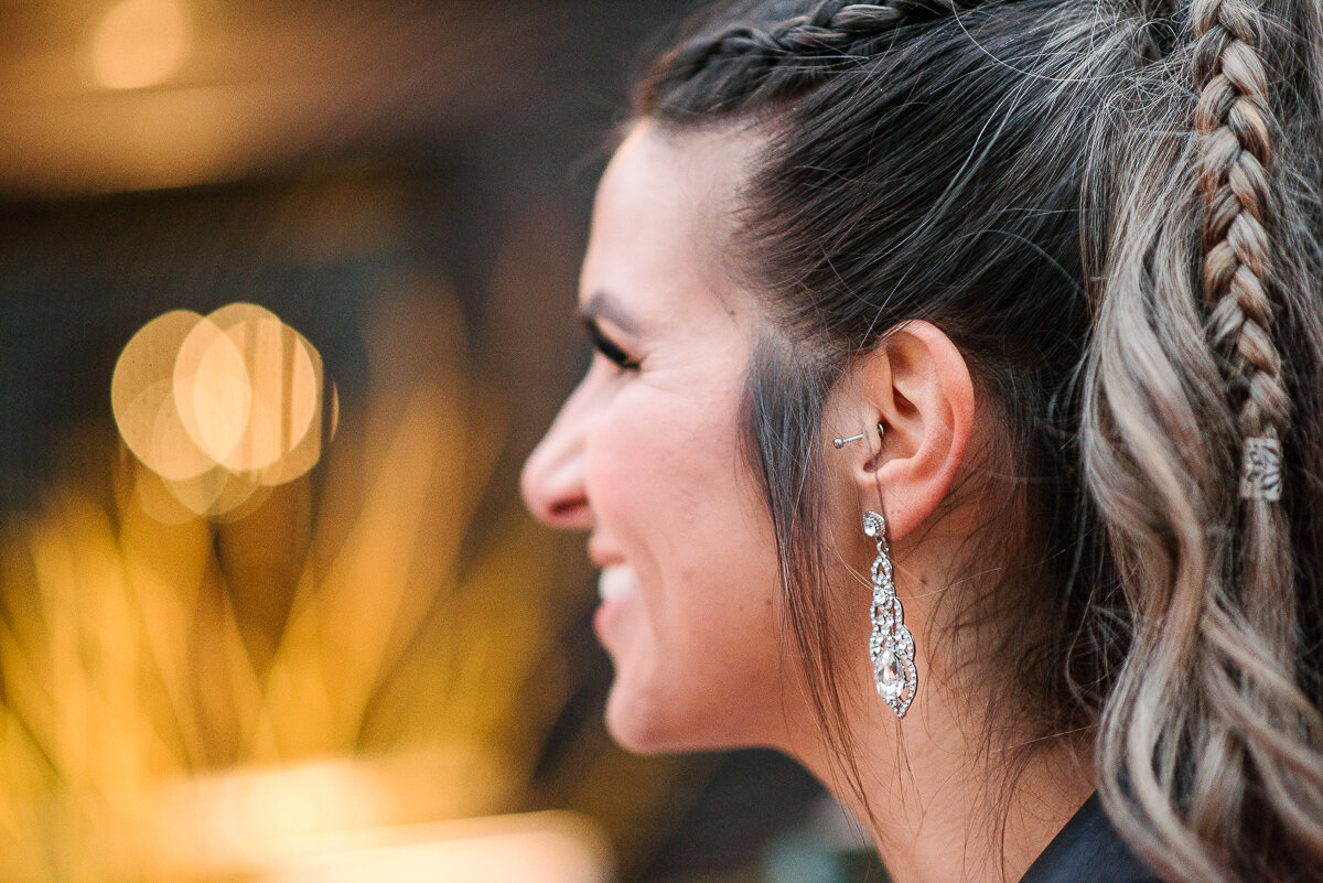 up-close image of brides earrings and hair 