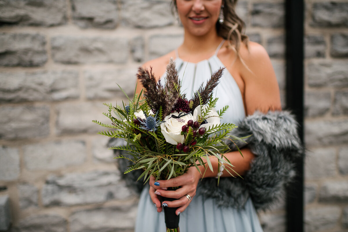 bride holding her winter themed bouquet 