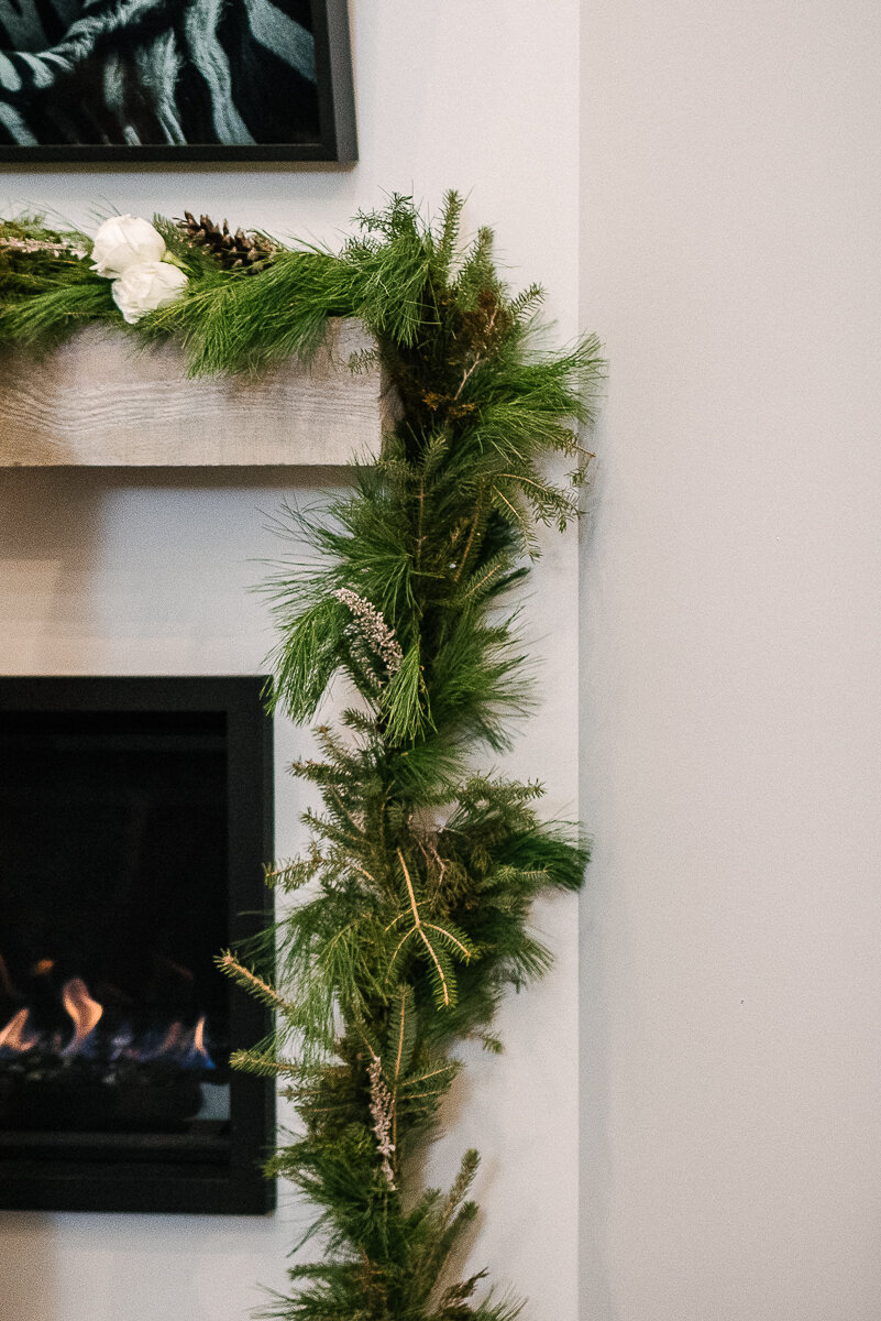 garland decoration for winter wedding over fireplace 