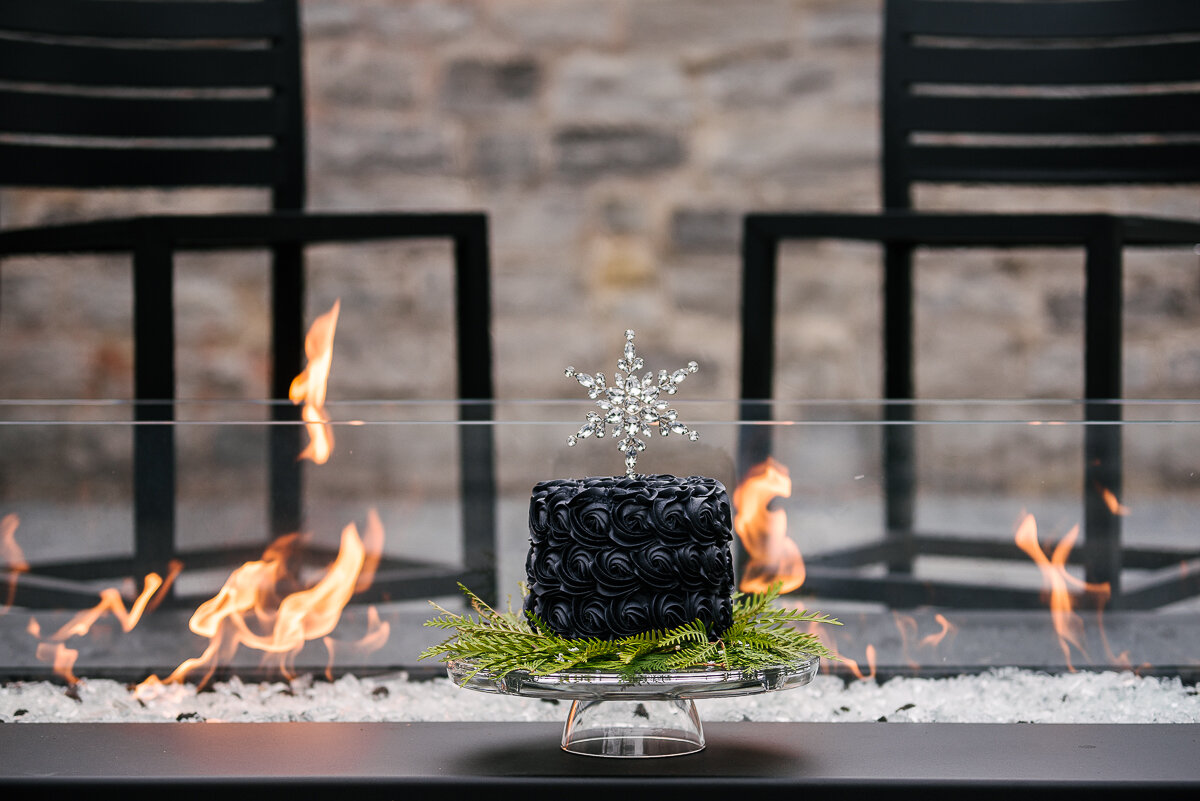 winter wedding cake infront of fire, fire and ice themed wedding 