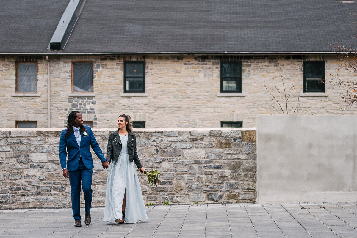 Bride and groom walking at The Frontenac Club in Kingston 