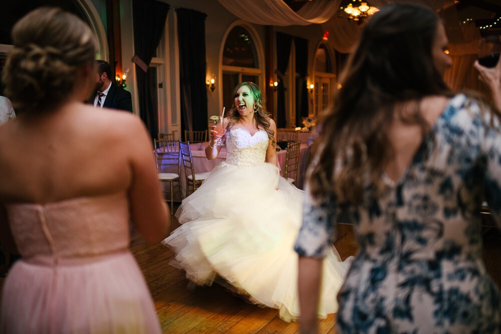 bride dancing in wedding dress at the reception at wedding reception at Isaiah Tubbs Resort