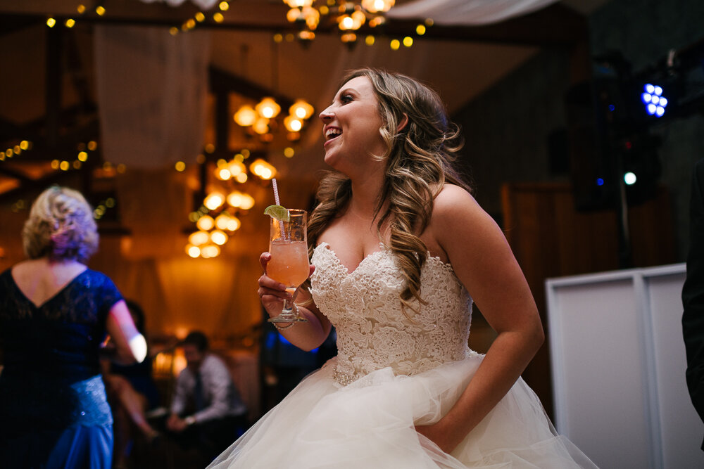 candid image of bride smiling at her wedding at wedding reception at Isaiah Tubbs Resort