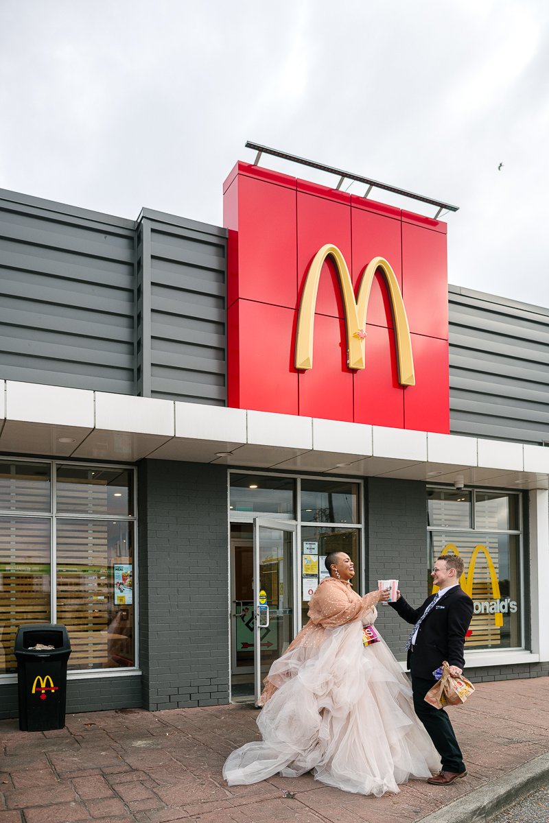 Bride and groom enjoying feast at McDonald