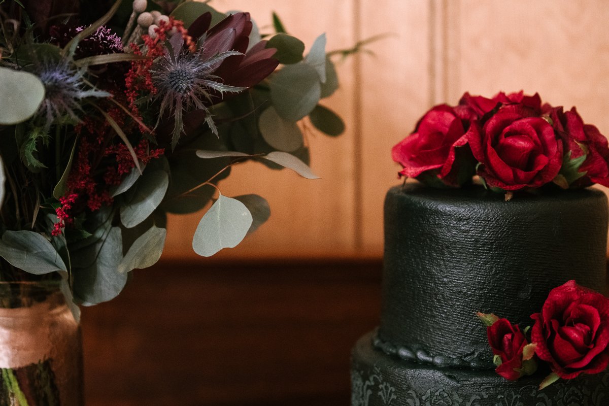 Wedding cake and flower bouquet black and red.