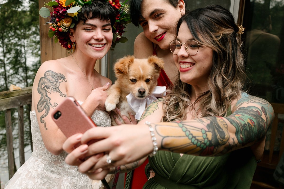 Happy bride with family taking selfie
