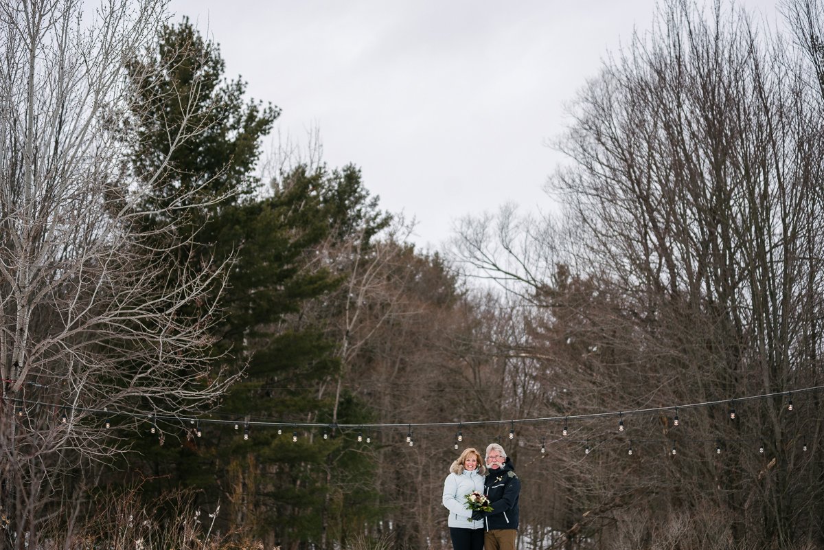 Newly Wedded couple posing in the winter season